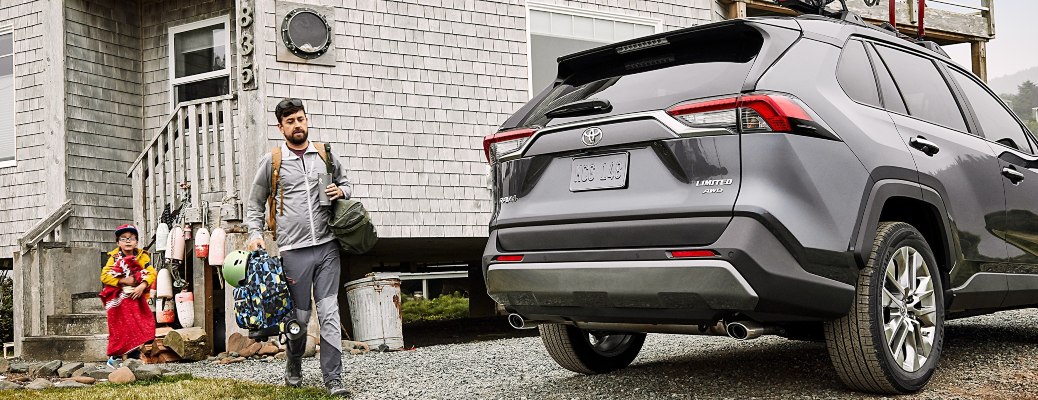 A family packing cargo into a 2021 Toyota RAV4