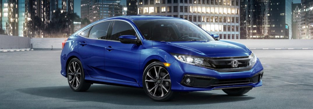 2021 Honda Civic Sedan driving down a city street