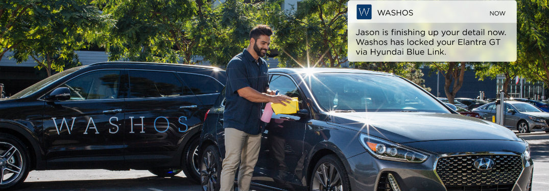 Washos employee cleaning Hyundai vehicle