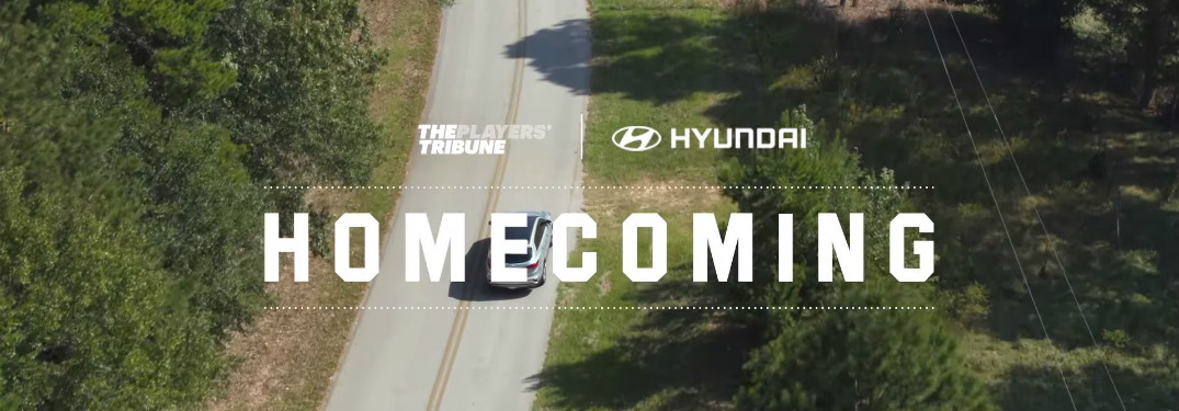 overhead view of Hyundai vehicle driving with Homecoming text