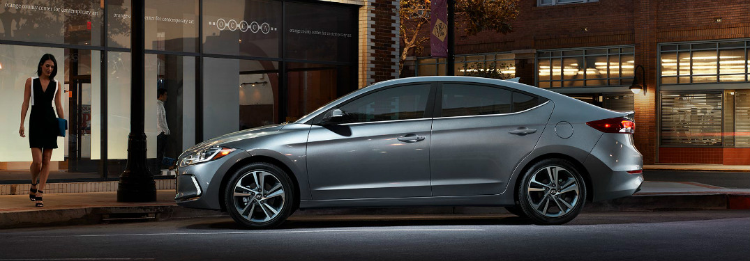 Woman walking towards a 2018 Hyundai Elantra