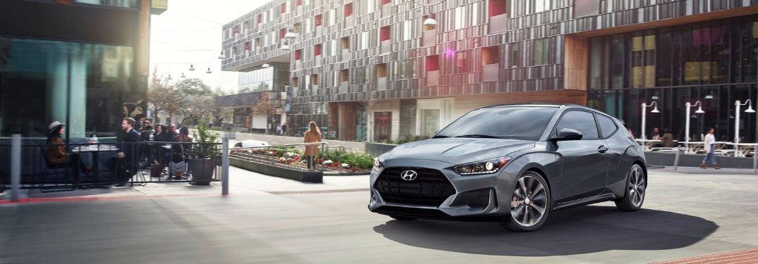 2020 Hyundai Veloster rounding a corner in the city