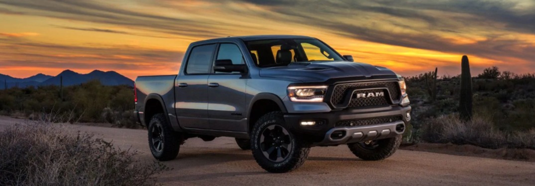 2019 Ram 1500 driving down a dirt road