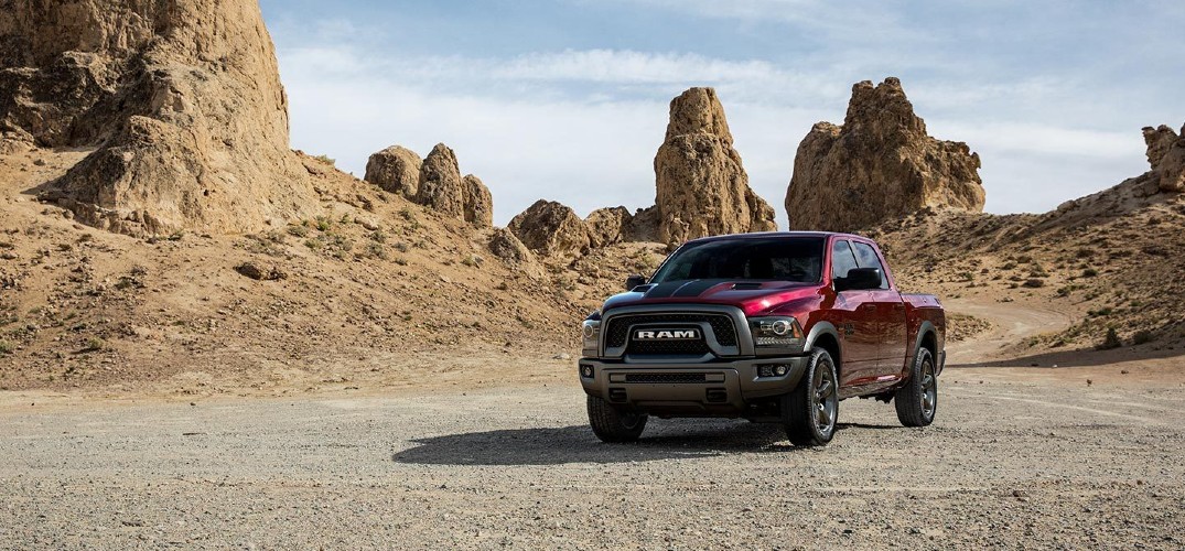 2019 Ram 1500 Classic red parked on gravel in desert mountain