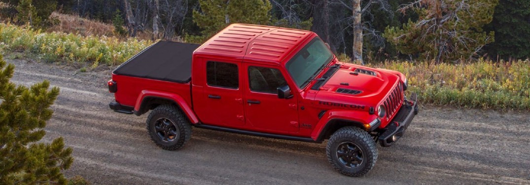 2020 Jeep Gladiator red paint birds eye view driving down mountain trail