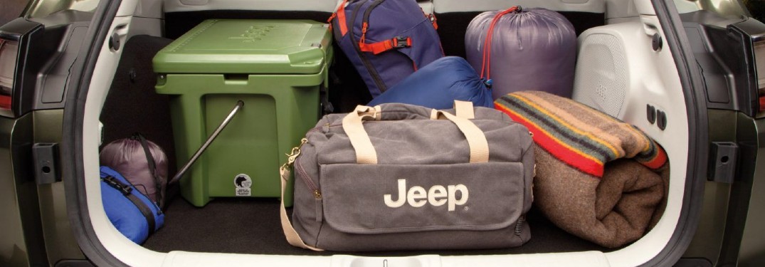 2020 Jeep Cherokee back end open loaded with totes and duffle bags