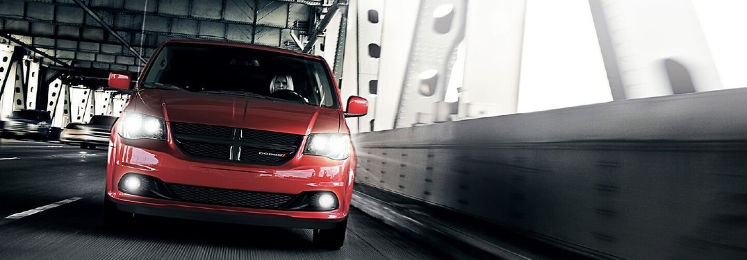 2020 Dodge Grand Caravan red paint driving on bridge with black and white filter
