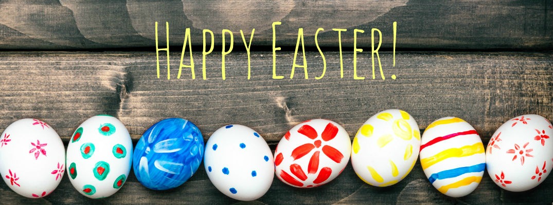 colored Easter eggs in a row on wooden boards with Happy Easter text overlaid