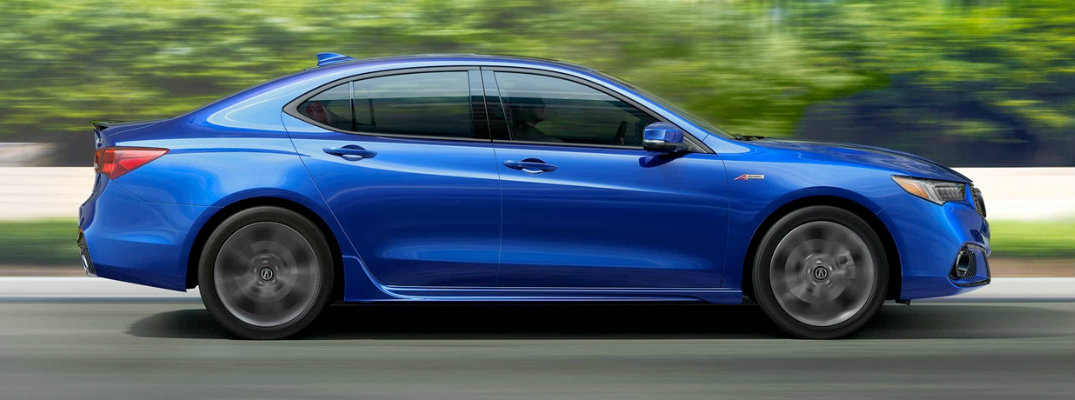 Profile view of blue 2018 Acura TLX driving on parkway in daytime