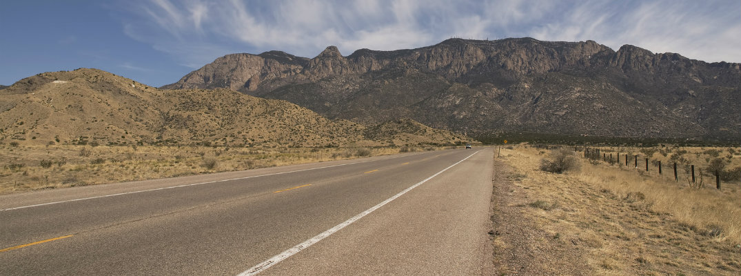 New Mexico road with monument in background