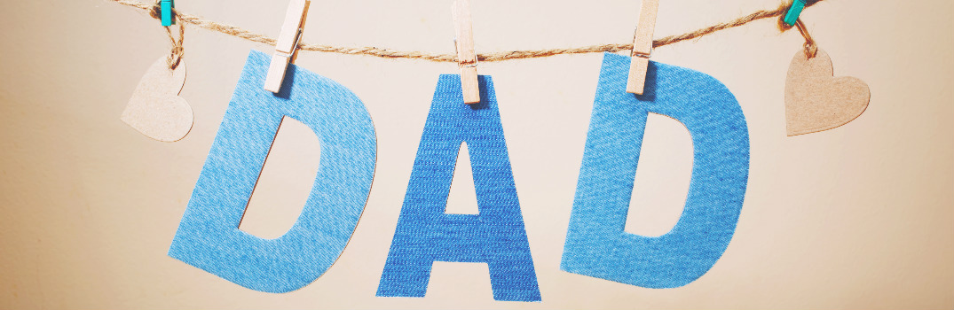 The Word "Dad" and Two Hearts Hanging from a Clothes Line