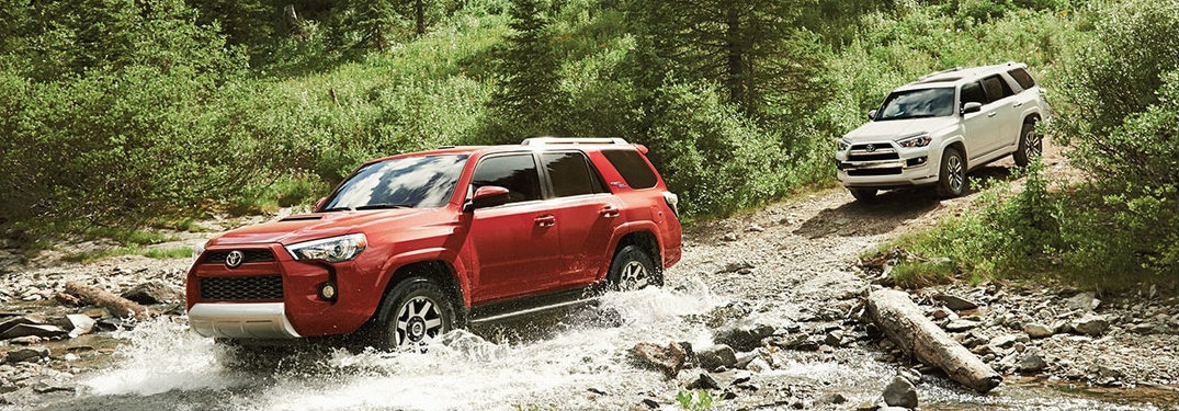 Two 2018 Toyota 4Runner Vehicles Driving Across a Stream