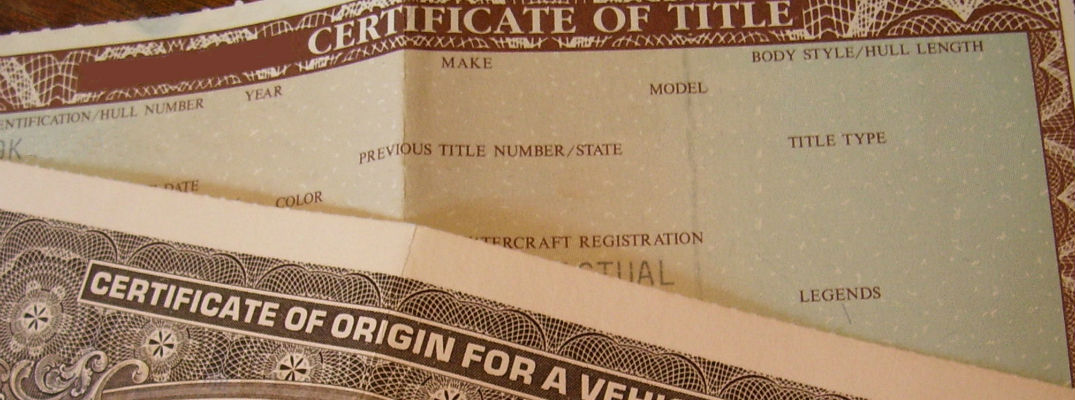 A stock photo of some paperwork needed when selling a car.