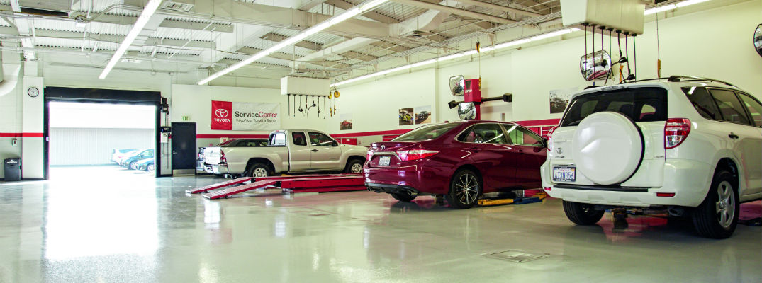 A stock photo of service bays at a Toyota dealership, similar to the one at Colonial Toyota.