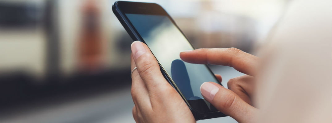 A stock photo of a person using a smartphone.