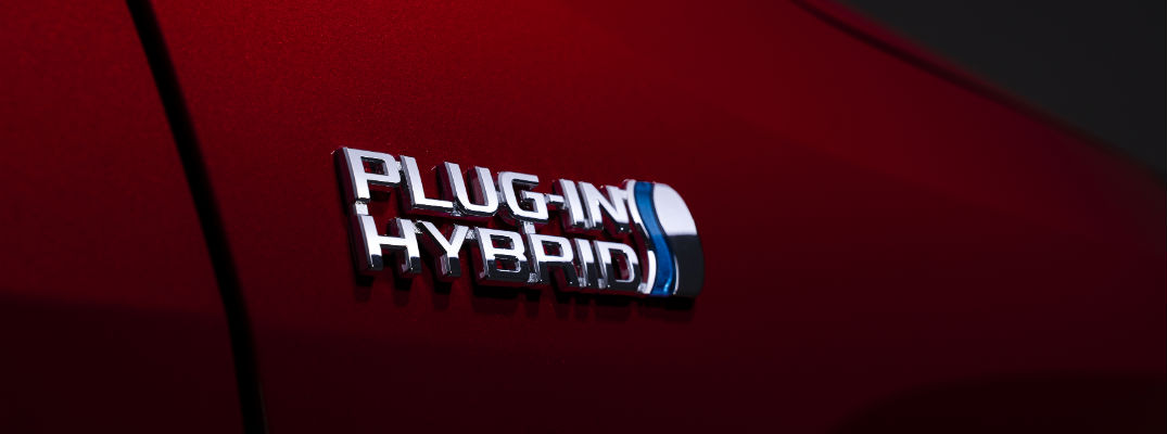 A photo of the Plug-In Hybrid badge worn by the 2021 Toyota RAV4 Prime.