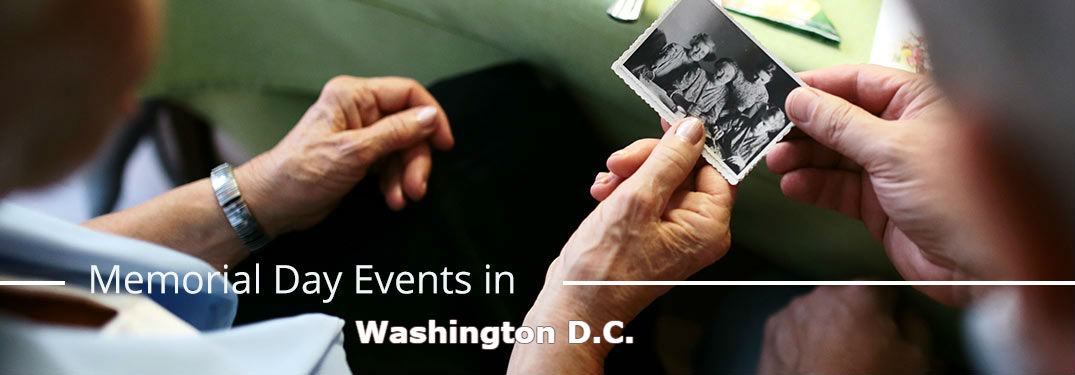 Elderly couple gazing at old photo with text saying Memorial Day Events in Washington D.C.