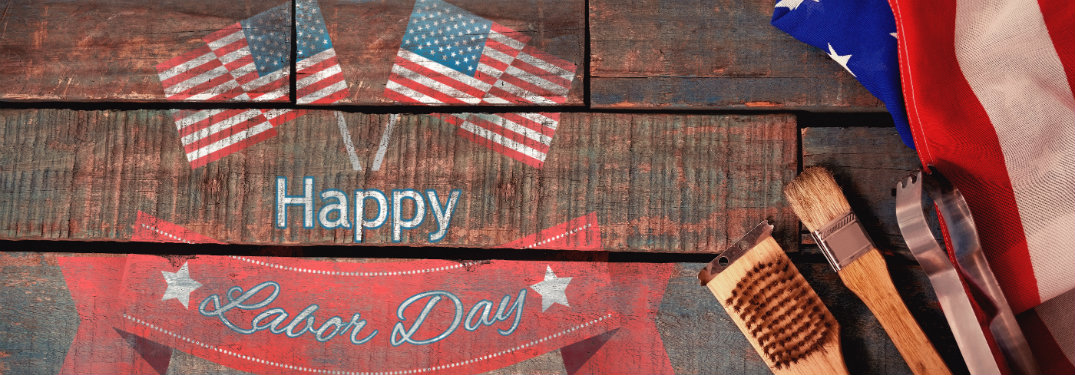 Wood painted sign with American flags and grilling tools