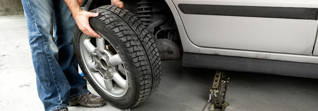 Mechanic changing the tire on a car