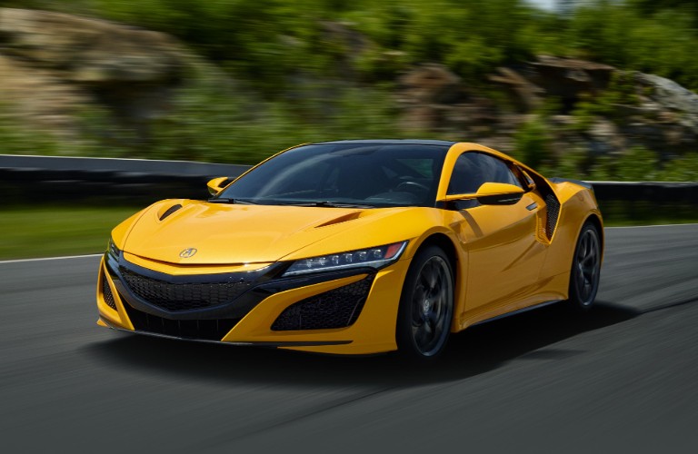 Front driver angle of a yellow 2020 Acura NSX