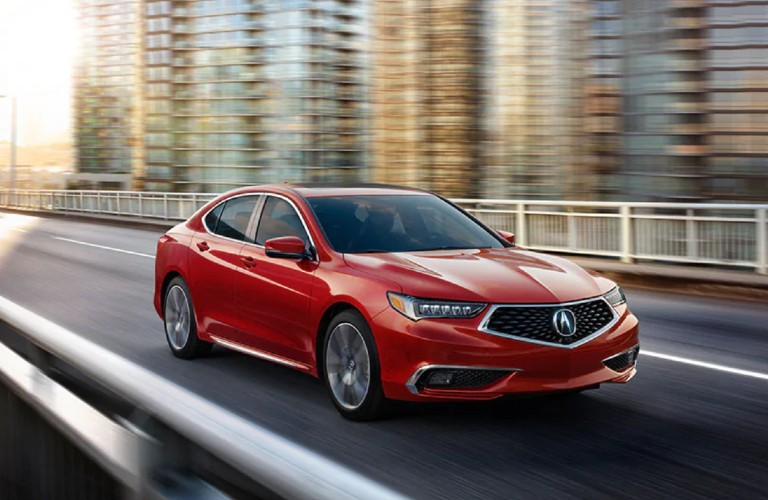 Front passenger angle of a red 2020 Acura TLX