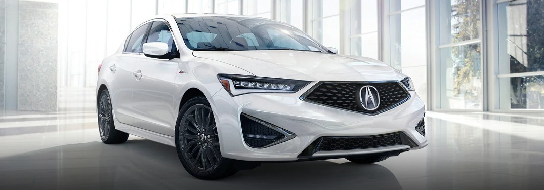 Front passenger angle of a white 2021 Acura ILX