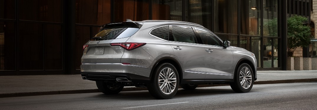 Rear passenger angle of a silver 2022 Acura MDX