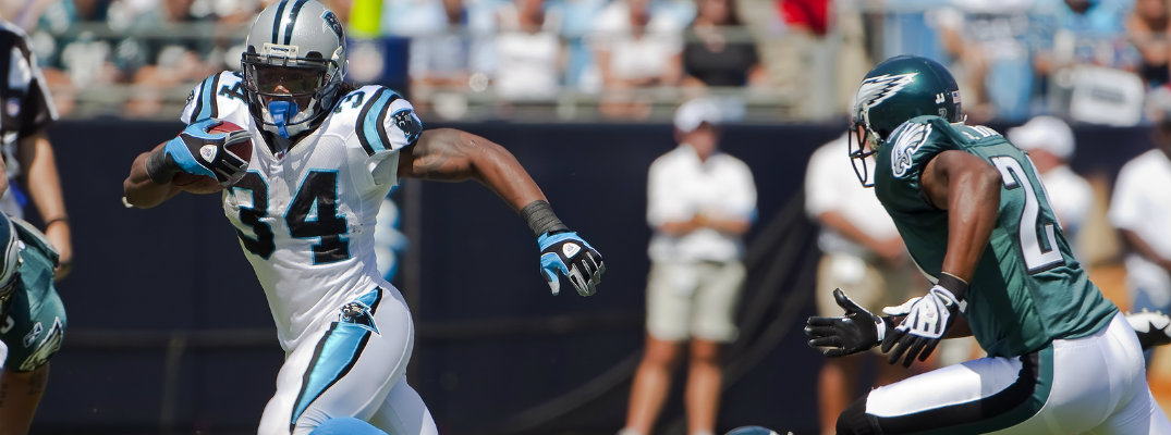 Philadelphia Eagles defender chasing down Panthers running back DeAngelo Williams