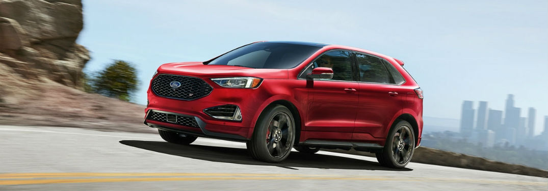 2020 Ford Edge exterior front fascia driver side on highway with city in distance