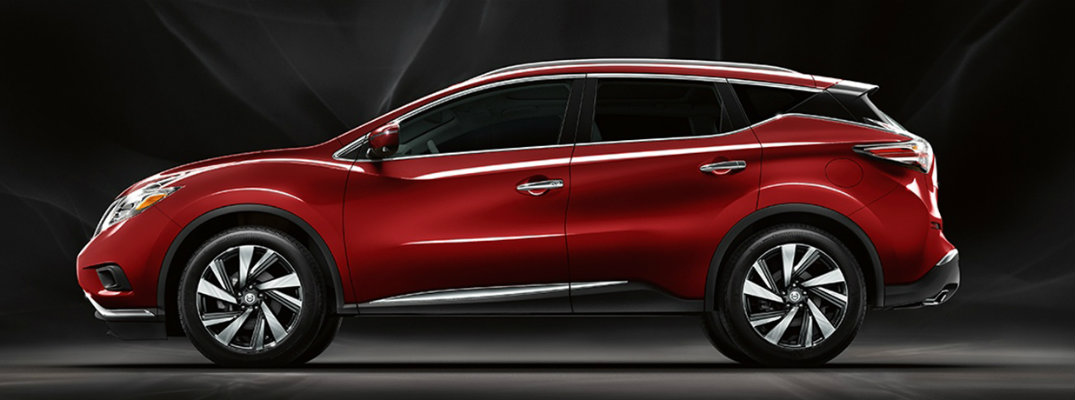 Exterior view of red 2018 Nissan Murano parked against dark background