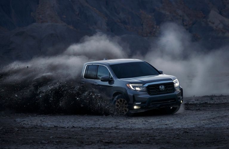 Gray 2021 Honda Ridgeline Kicking Up Mud