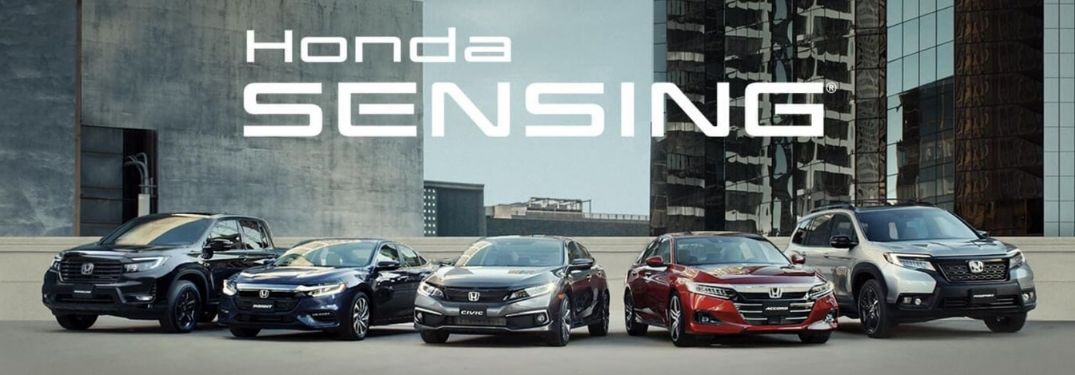 Image showing various Honda cars parked in front of buildings with Honda Sensing text written above