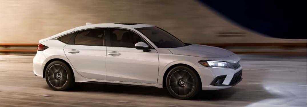 A white 2022 Honda Civic Hatchback on a road