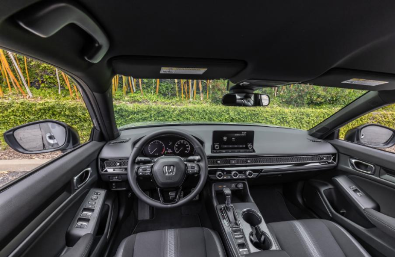 Steering wheel and interior of the 2022 Honda Civic Sedan Sport