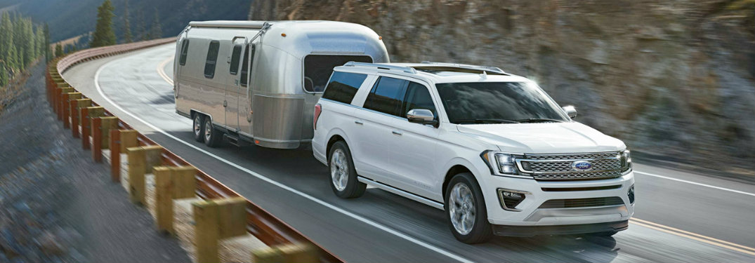 2018 Ford Expedition front view white towing trailer on road