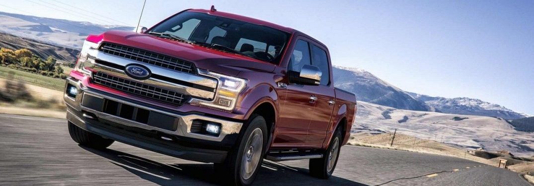 2018 Ford F-150 driving on a highway in a prarie
