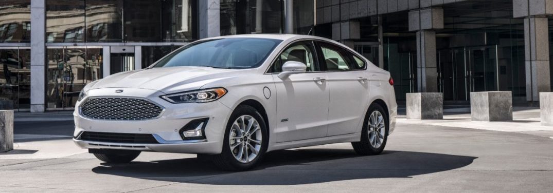 2019 Ford Fusion front quarter profile in front of a glass building