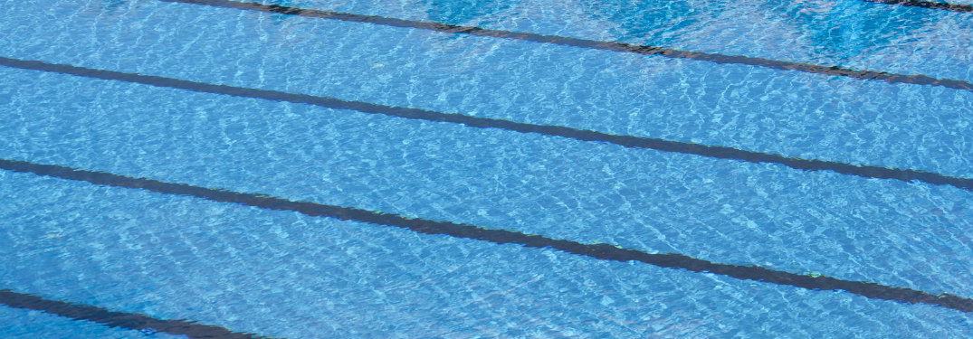 view of indoor swimming pools with lap lines