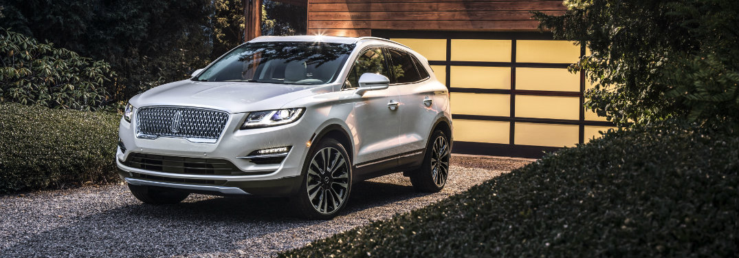 front and side view of white 2019 lincoln mkc