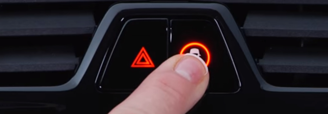 Finger Pressing the BMW Intelligent Safety Button