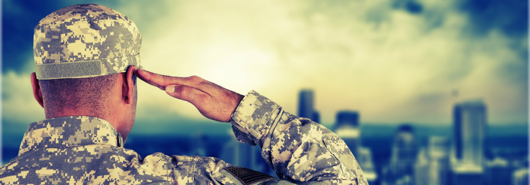american soldier in uniform saluting to skyline of city