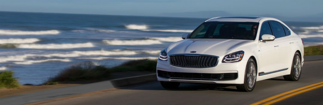 2019 Kia K900 next to the ocean