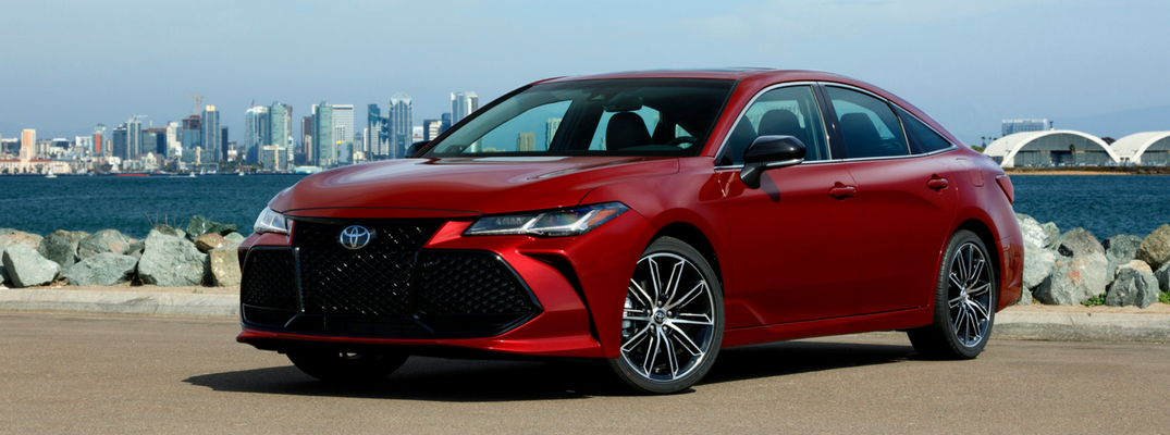 Red 2019 Toyota Avalon near an ocean-side city