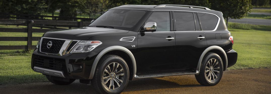 Side view of the 2018 Nissan Armada in the countryside