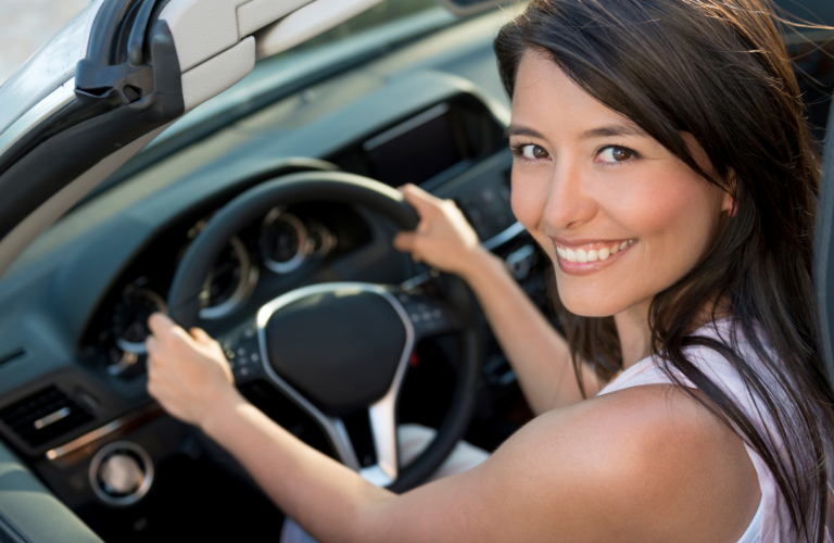 A woman driving a vehicle