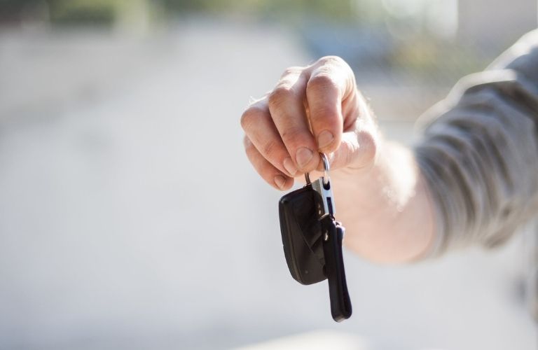 Hand holding a car key