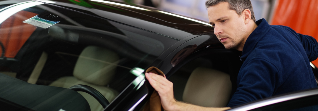 Man cleaning the vehicle