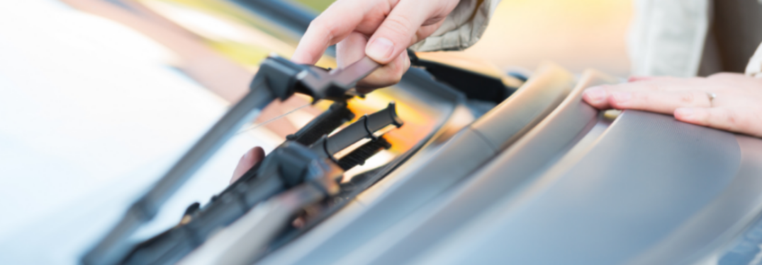 A man holding Windshield wiper