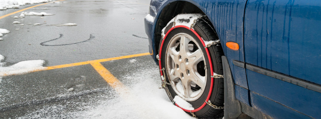 Parked car with tire chains on