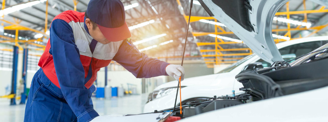 Car mechanic inspecting an engine